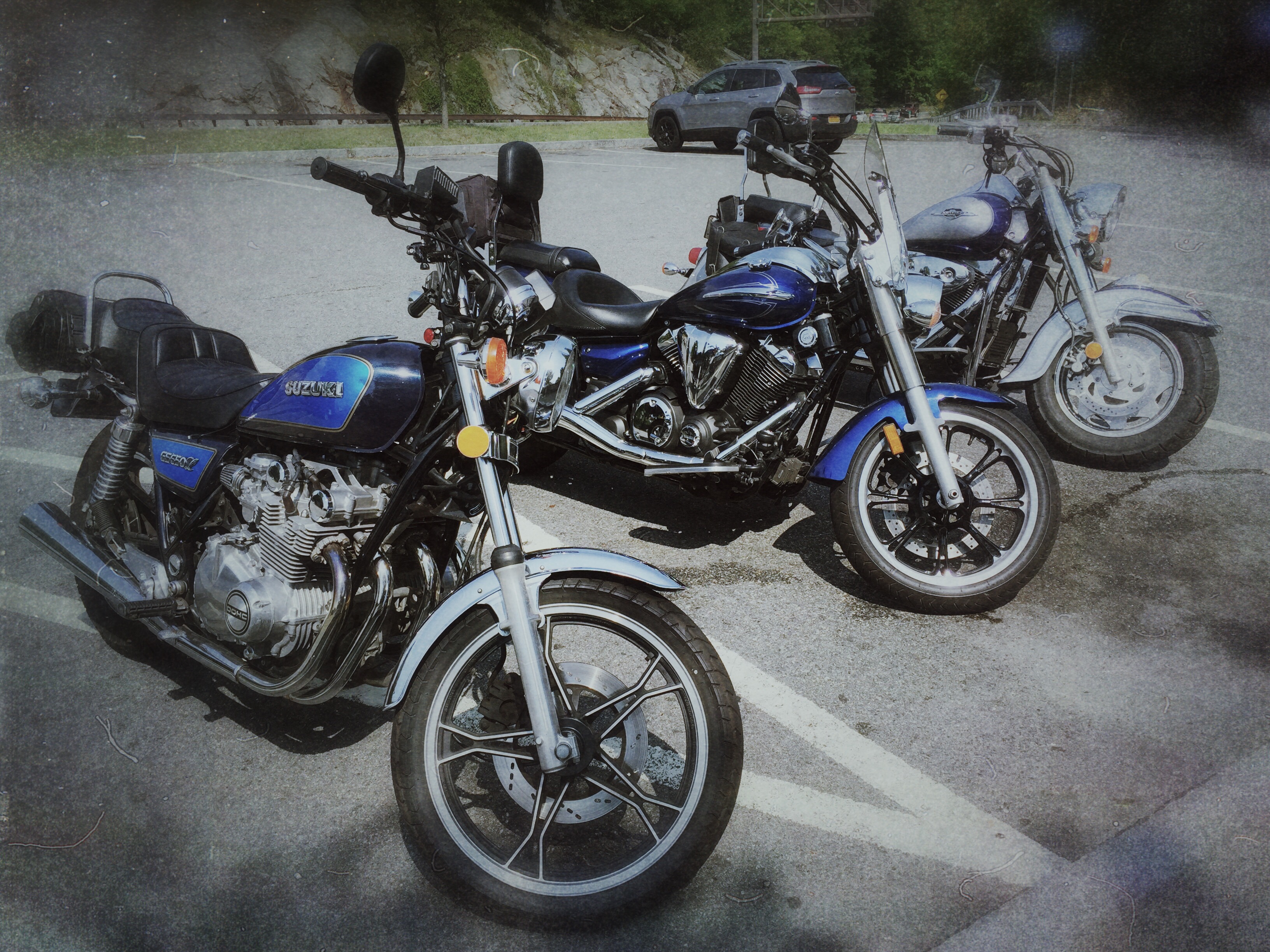 Three motorcycles parked together